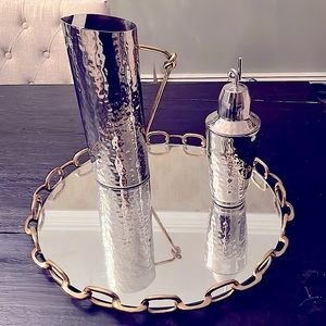 Mirror platter with gold rings around border, silver metal pitcher & shaker